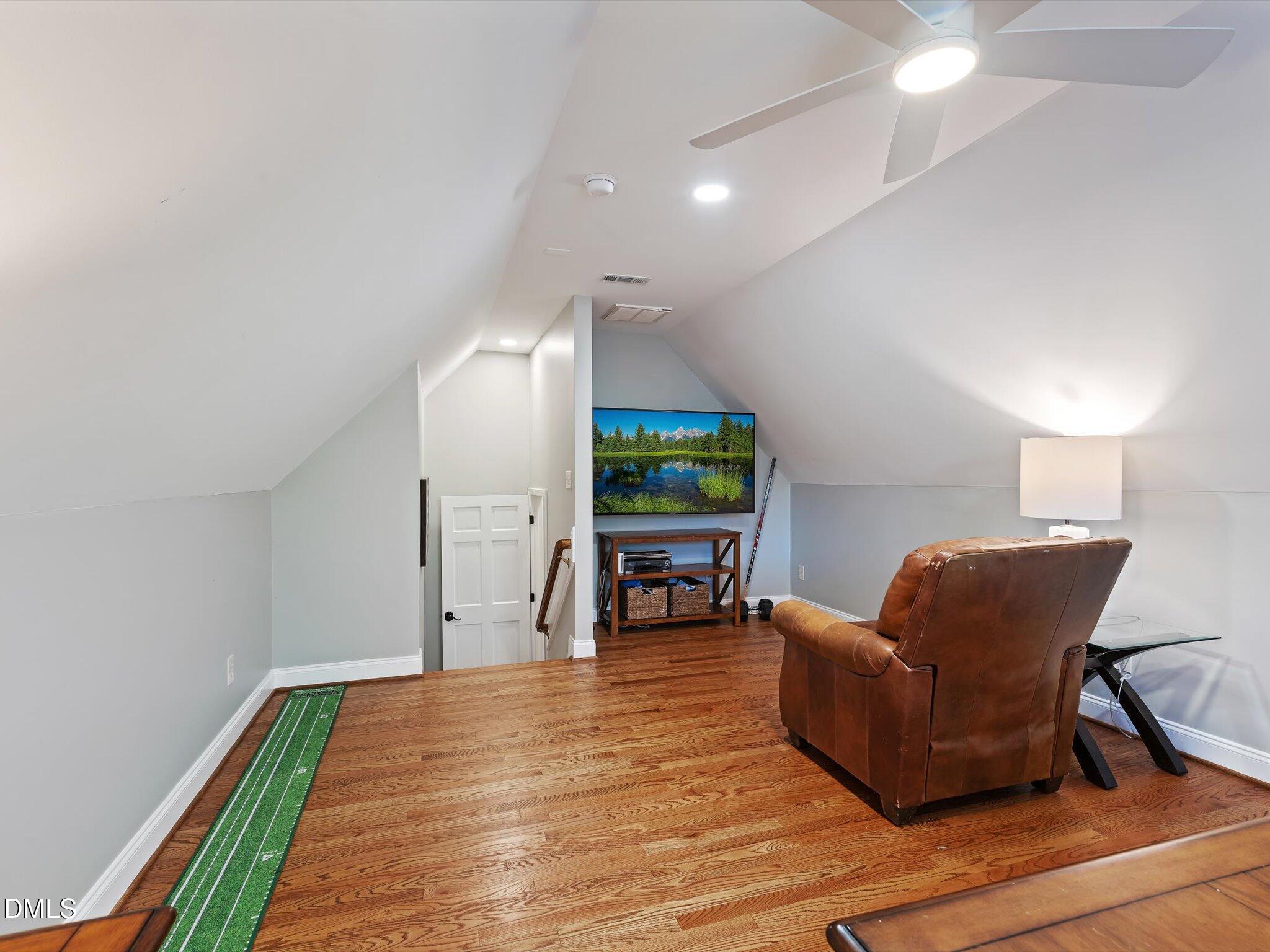 4201 Falls River Avenue Raleigh, NC 27614 - Photo 29 of 52 a living room with furniture and a wooden floor