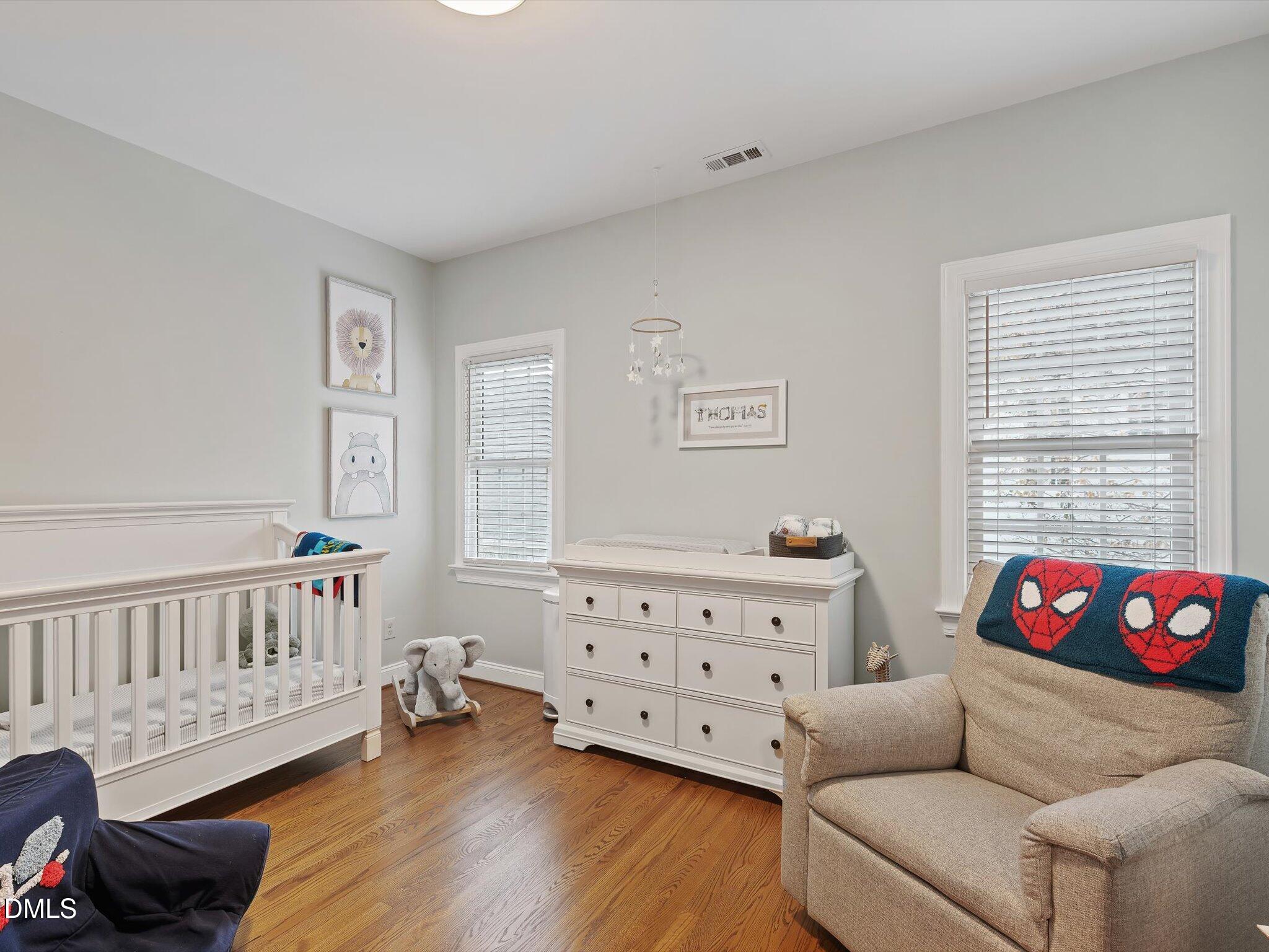 4201 Falls River Avenue Raleigh, NC 27614 - Photo 40 of 52 a bedroom with furniture and a window