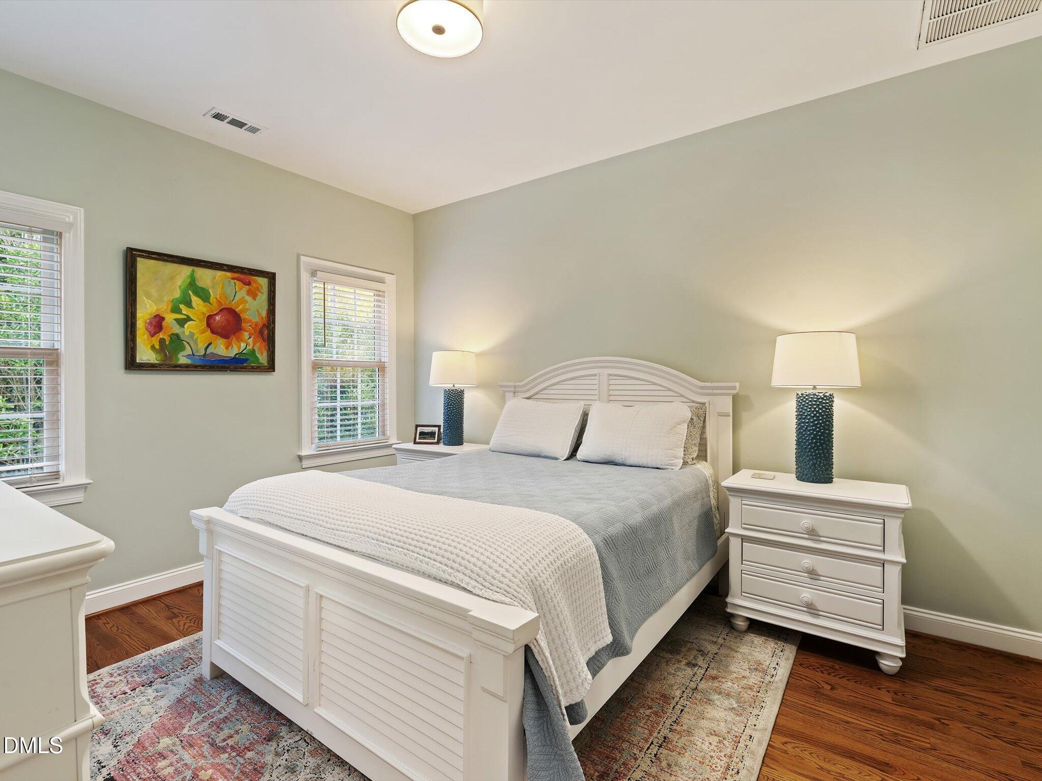 4201 Falls River Avenue Raleigh, NC 27614 - Photo 42 of 52 a bedroom with a bed and a table