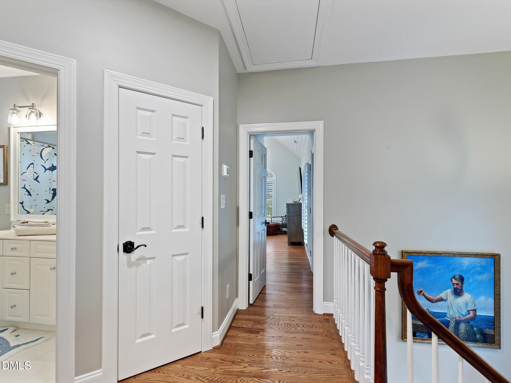 4201 Falls River Avenue Raleigh, NC 27614 - Photo 44 of 52 a view of a hallway with wooden floor and closet