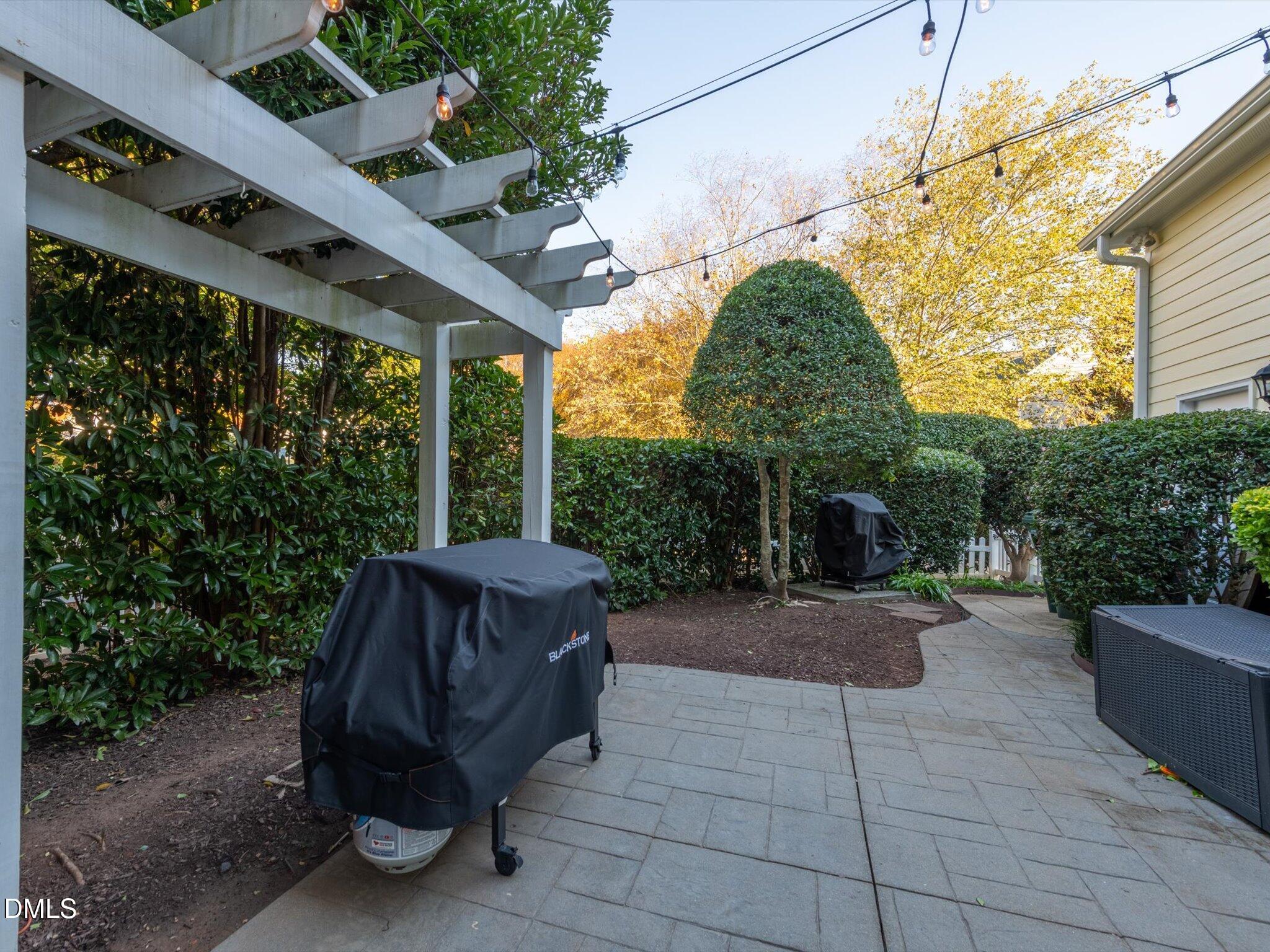 4201 Falls River Avenue Raleigh, NC 27614 - Photo 7 of 52 a view of backyard with outdoor seating and green space