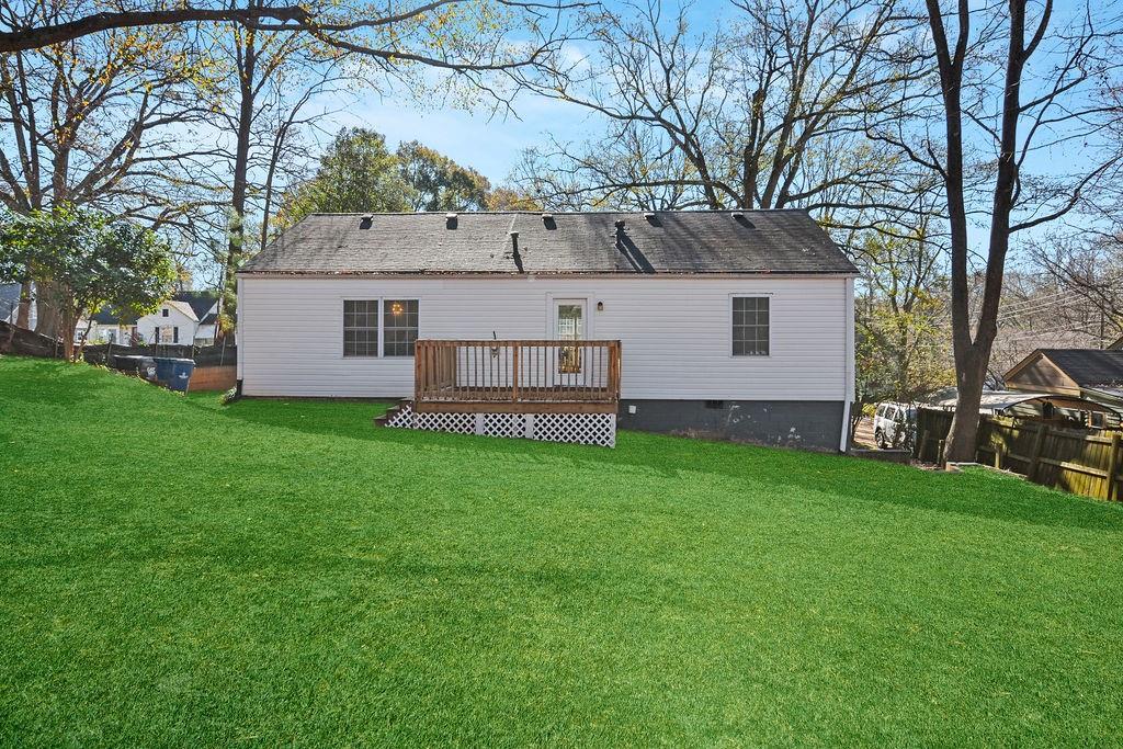 1917 Spring Avenue Atlanta, GA 30344 - Photo 22 of 22 a view of a house with backyard and garden