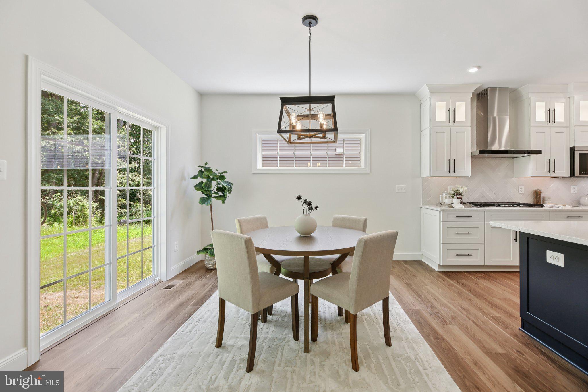 1823 Colt Lane Frederick, MD 21702 - Photo 19 of 66 a view of a dining room with furniture window and wooden floor
