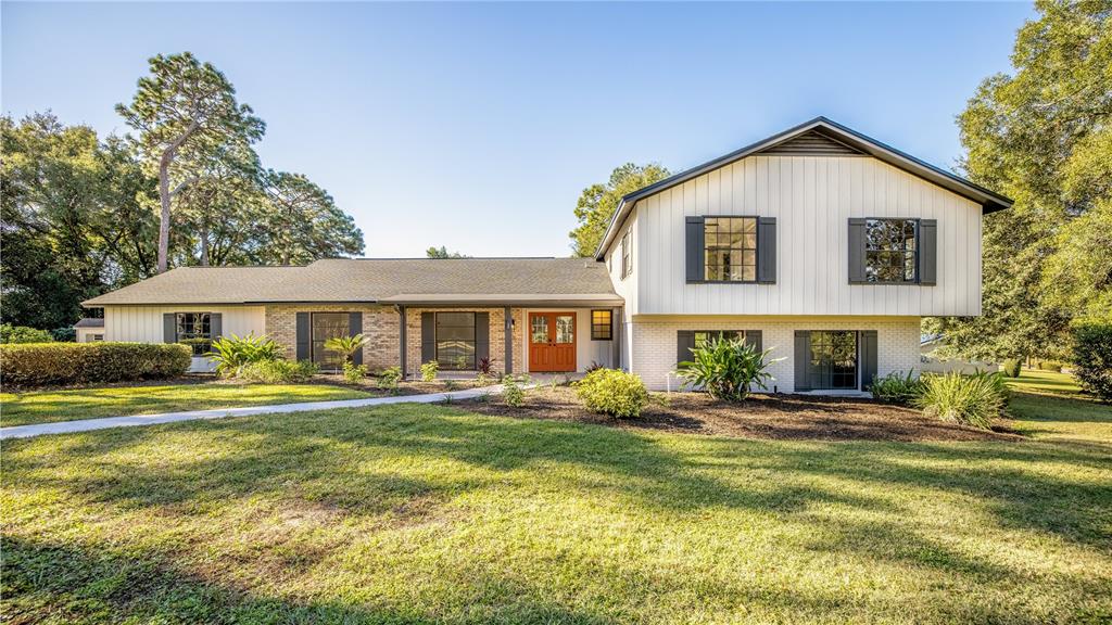 4 Quail Run Longwood, FL 32779 - Photo 1 of 1 a front view of a house with a yard