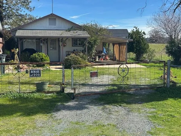 a front view of house with garden