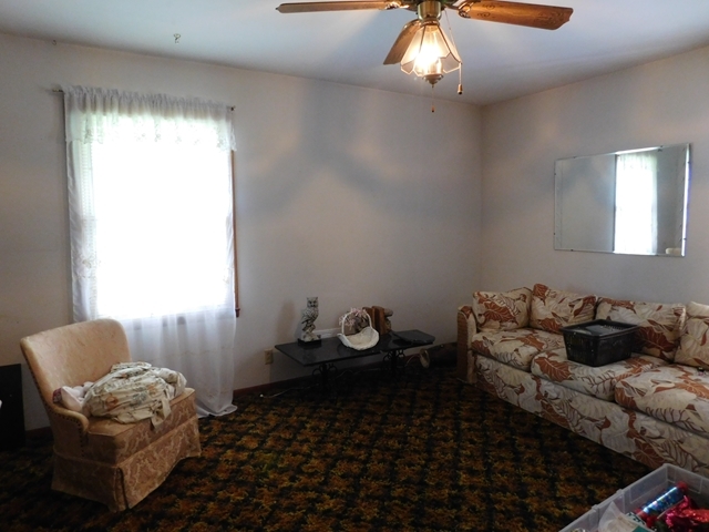 303 Pinecrest Road Warner Robins, GA 31093 - Photo 4 of 6 a room with furniture toys and a window