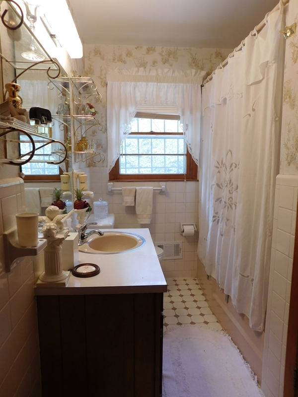 303 Pinecrest Road Warner Robins, GA 31093 - Photo 5 of 6 a view of a bathroom with sink and mirror