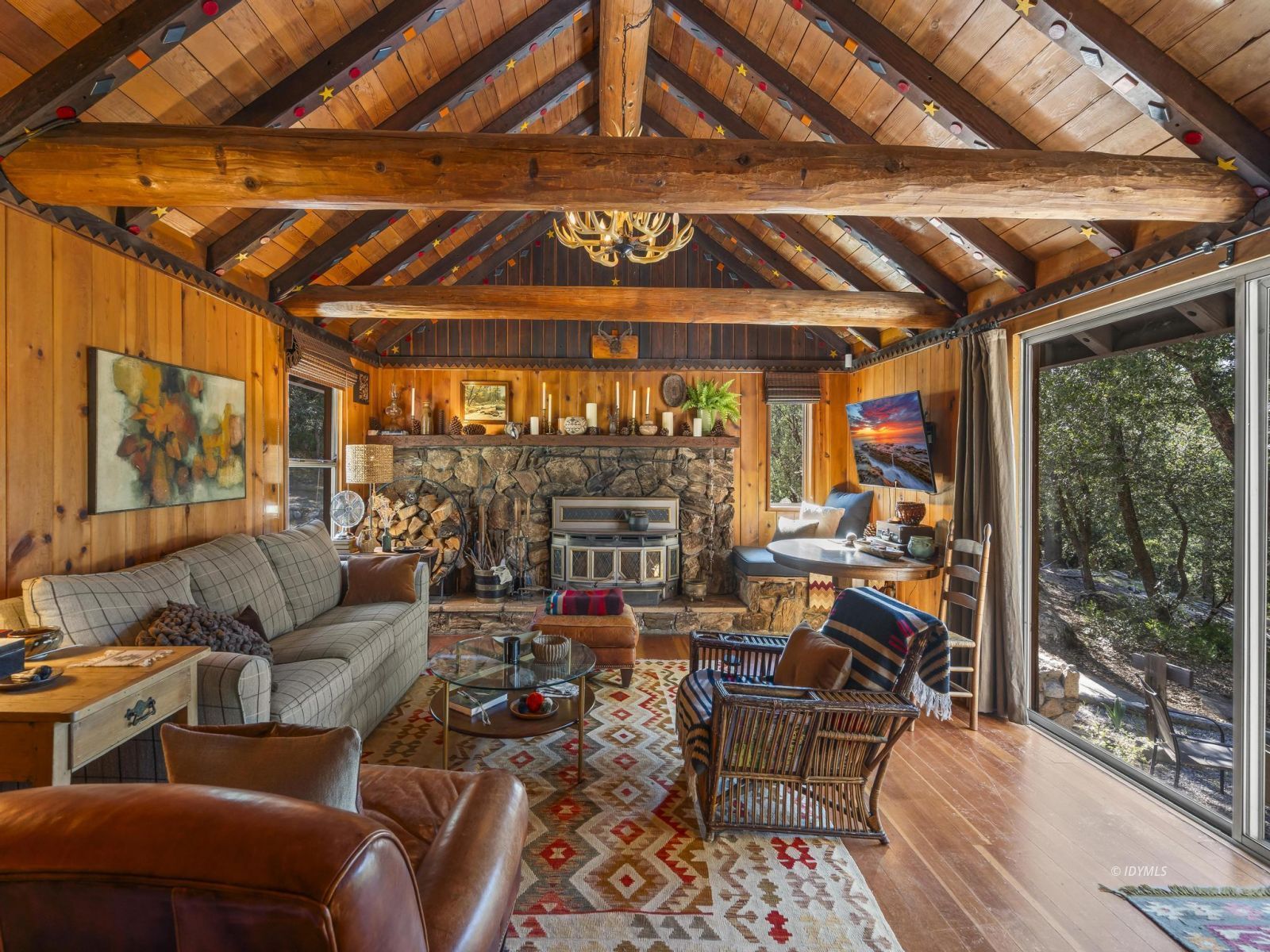53241 Middleridge Drive Idyllwild, CA 92549 - Photo 13 of 48 a living room with lots of furniture and a chandelier