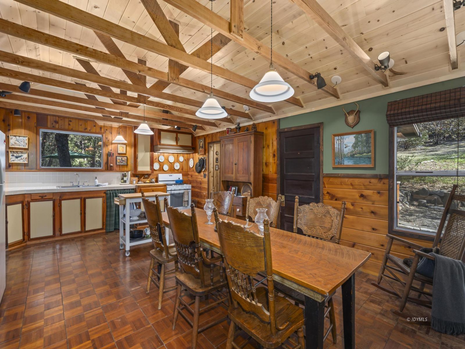 53241 Middleridge Drive Idyllwild, CA 92549 - Photo 25 of 48 a view of a dining room with furniture window and wooden floor