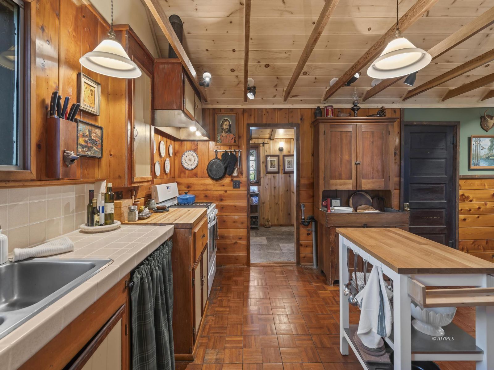 53241 Middleridge Drive Idyllwild, CA 92549 - Photo 26 of 48 a kitchen with a sink appliances and cabinets