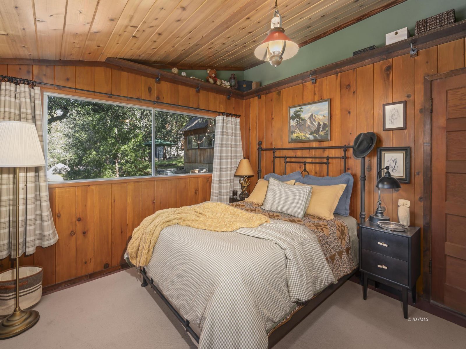 53241 Middleridge Drive Idyllwild, CA 92549 - Photo 29 of 48 a bed sitting in a bedroom next to a window