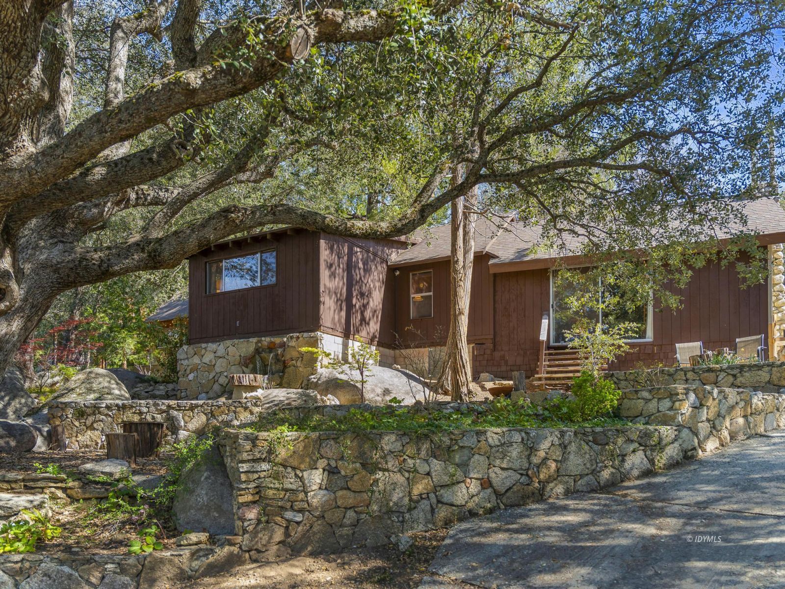 53241 Middleridge Drive Idyllwild, CA 92549 - Photo 6 of 48 a front view of a house with garden