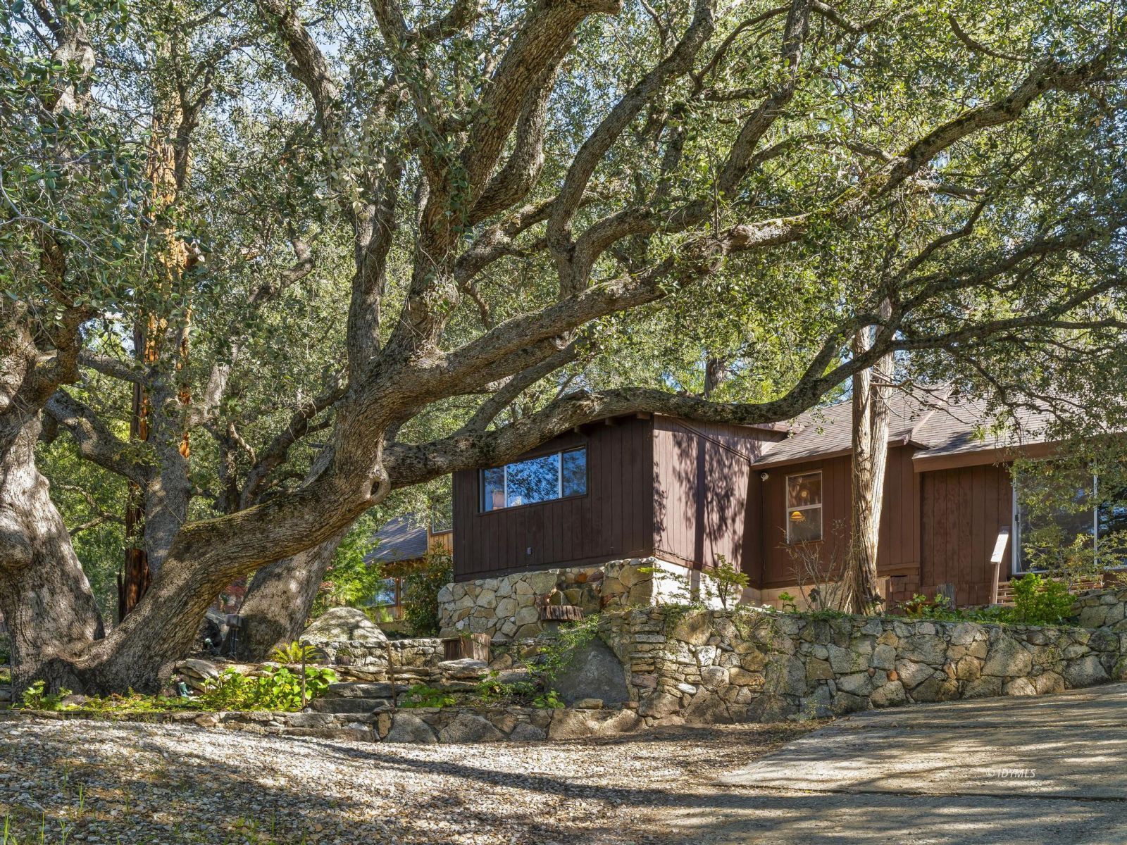 53241 Middleridge Drive Idyllwild, CA 92549 - Photo 9 of 48 a front view of a house with garden