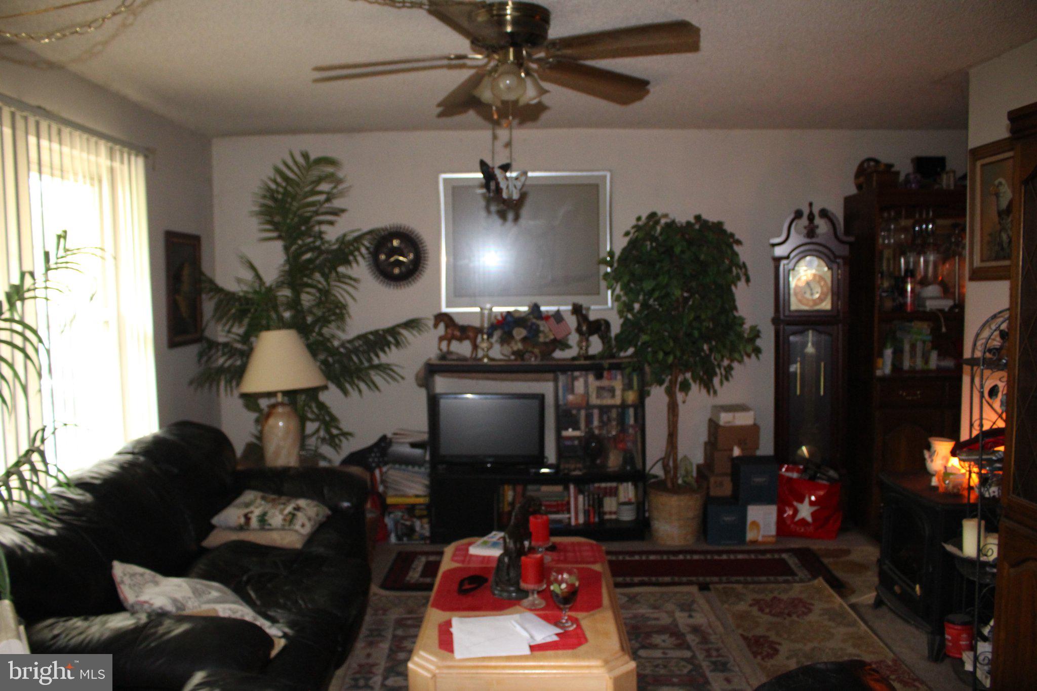 222 Ogden Sta Road Deptford, NJ 08090 - Photo 9 of 37 Cozy living space with vibrant decor.