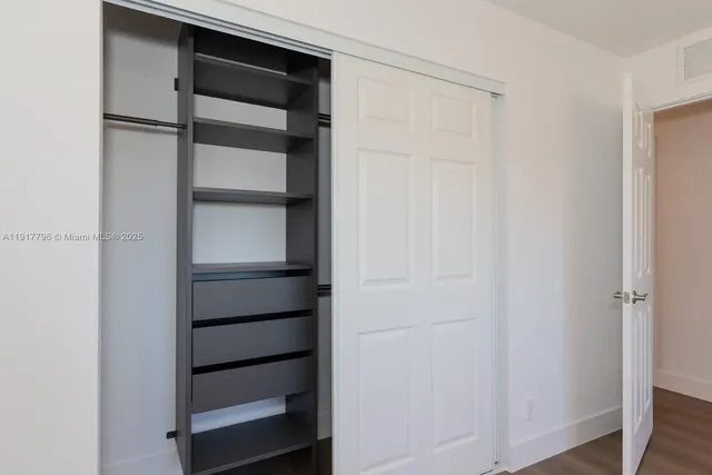 a view of an empty walk in closet