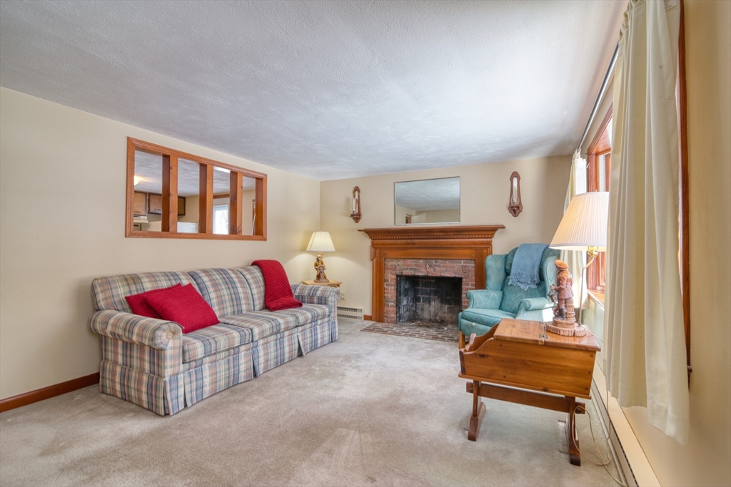 41 Taylor Road Maynard, MA 01754 - Photo 11 of 27 a living room with furniture and a fireplace