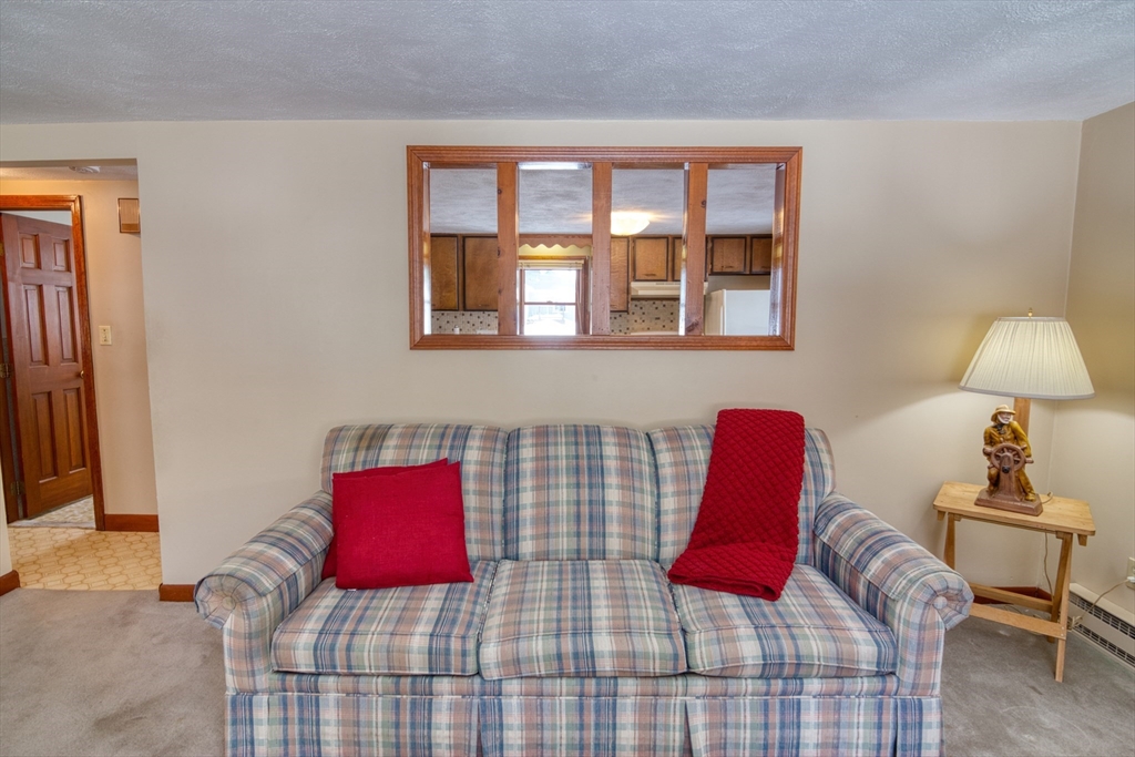 41 Taylor Road Maynard, MA 01754 - Photo 13 of 27 a bedroom with a bed and a lamp