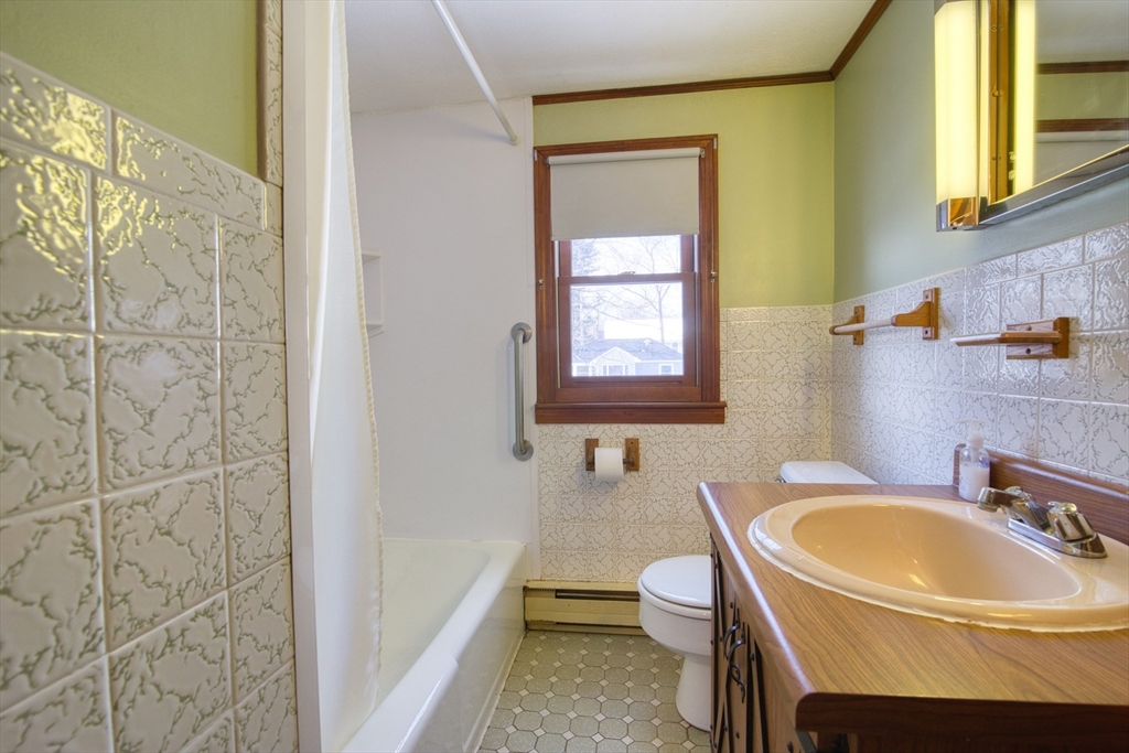 41 Taylor Road Maynard, MA 01754 - Photo 17 of 27 a bathroom with a sink a toilet and bathtub