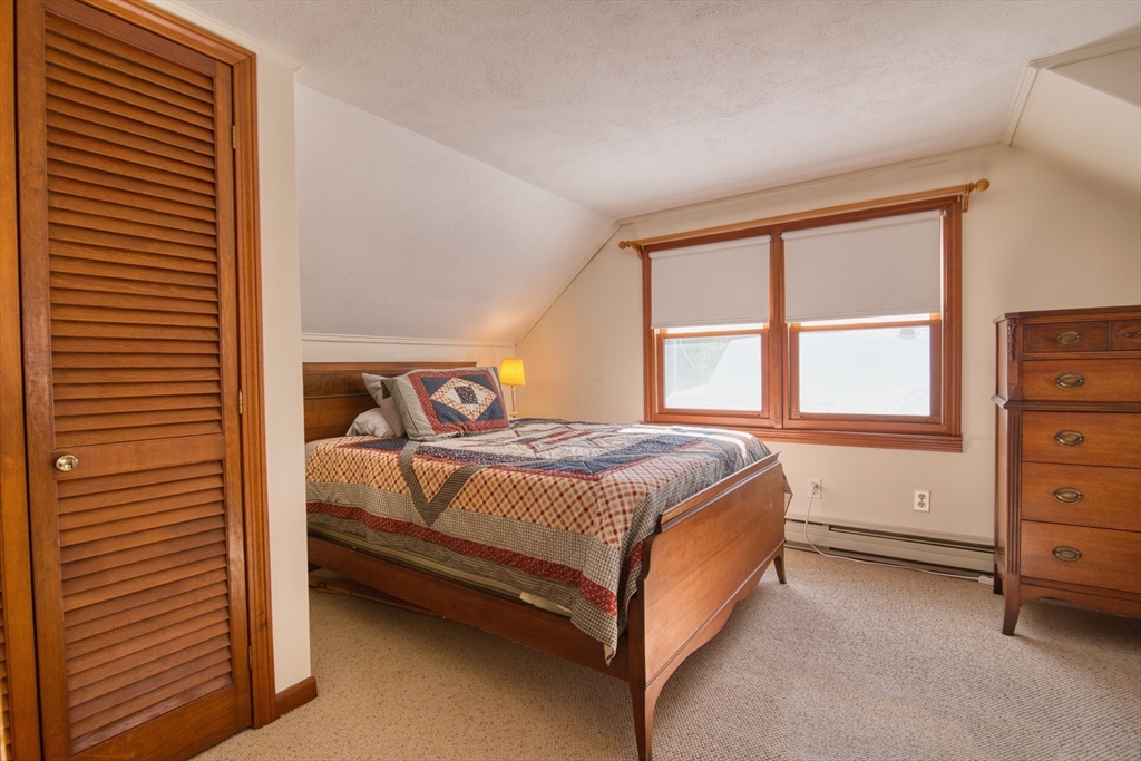 41 Taylor Road Maynard, MA 01754 - Photo 18 of 27 a bedroom with a bed and a window