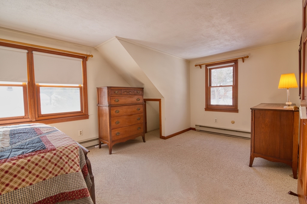 41 Taylor Road Maynard, MA 01754 - Photo 19 of 27 a view of a bedroom with furniture and windows