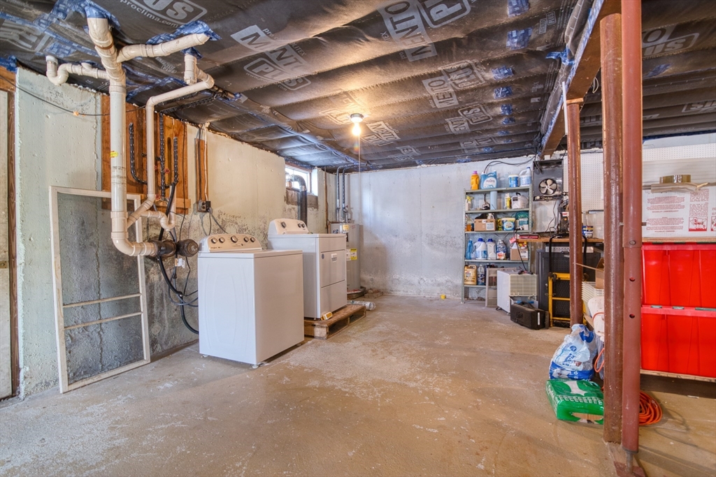 41 Taylor Road Maynard, MA 01754 - Photo 22 of 27 a view of a storage room with washer and dryer