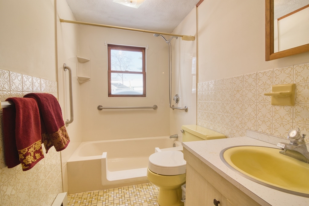 41 Taylor Road Maynard, MA 01754 - Photo 7 of 27 a bathroom with a sink toilet and shower