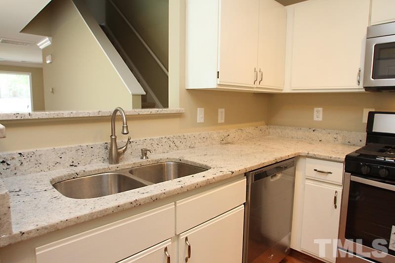 4020 Sudbury Road Durham, NC 27704 - Photo 5 of 12 Granite Countertops and under sink.