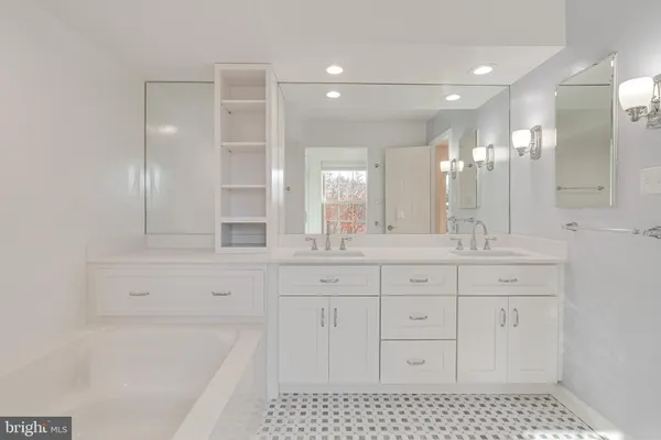 a bathroom with a sink a vanity and a mirror
