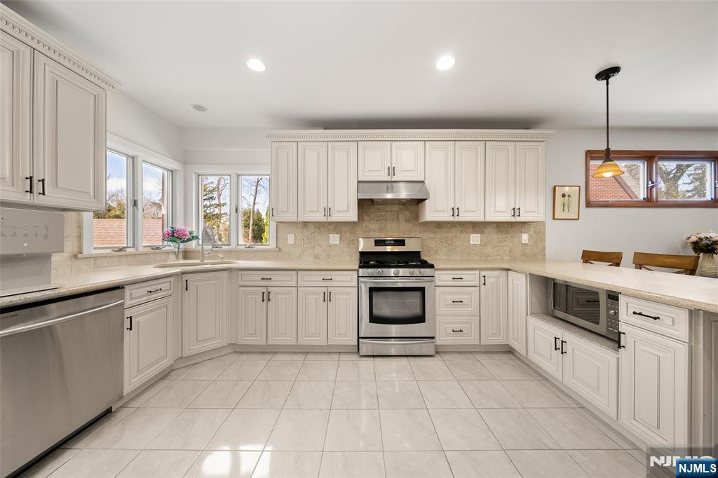 19 Central Avenue Demarest, NJ 07627 - Photo 11 of 49 a kitchen with cabinets appliances and a window