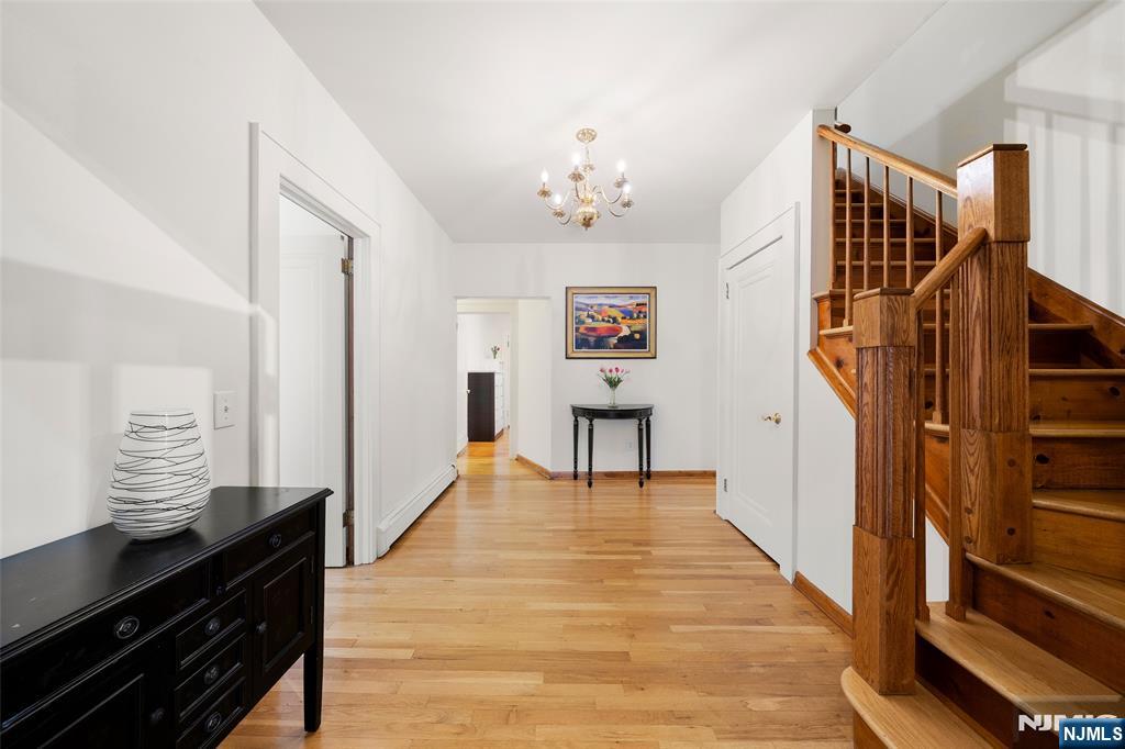 19 Central Avenue Demarest, NJ 07627 - Photo 16 of 49 a view of entryway and hall with wooden floor