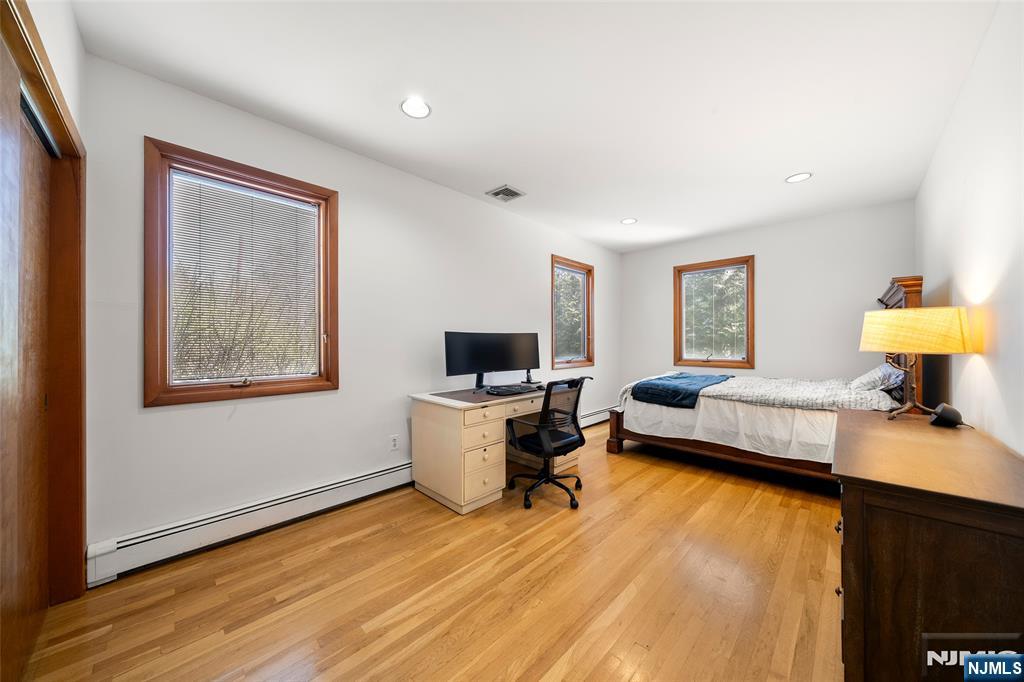 19 Central Avenue Demarest, NJ 07627 - Photo 23 of 49 a living room with furniture and a flat screen tv