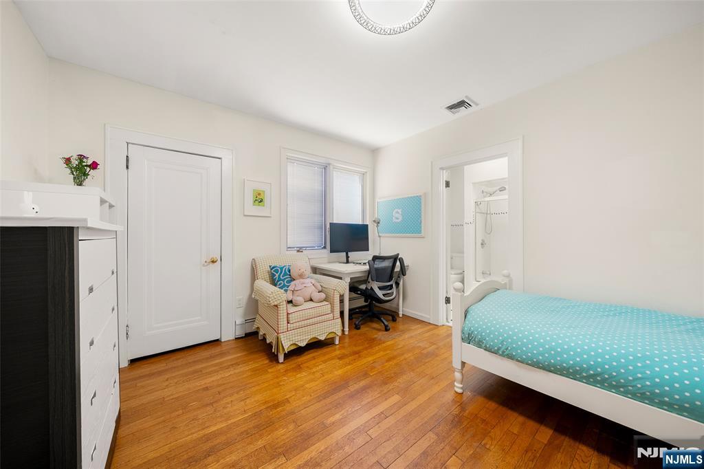 19 Central Avenue Demarest, NJ 07627 - Photo 25 of 49 a bed room with a bed and furniture