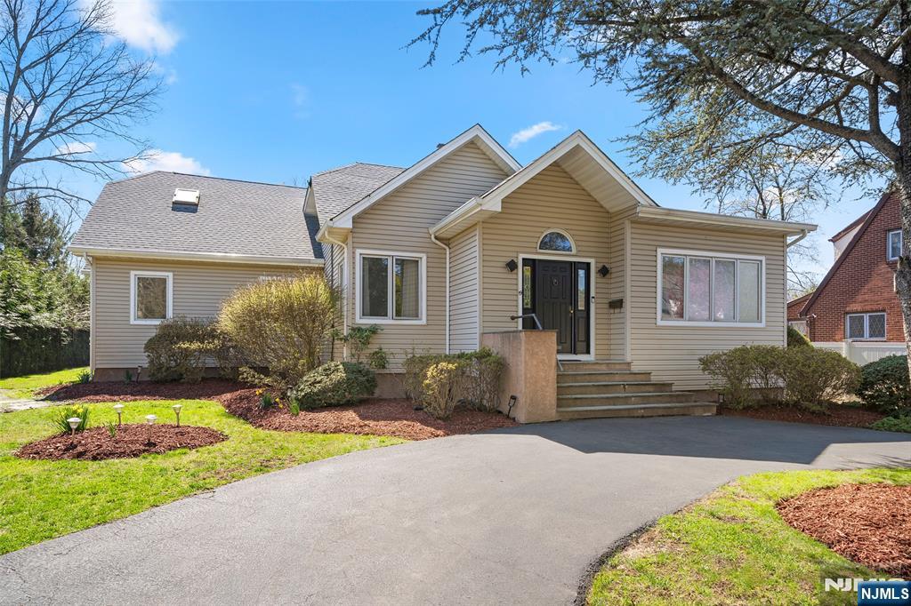 19 Central Avenue Demarest, NJ 07627 - Photo 4 of 49 a front view of a house with a yard and outdoor seating