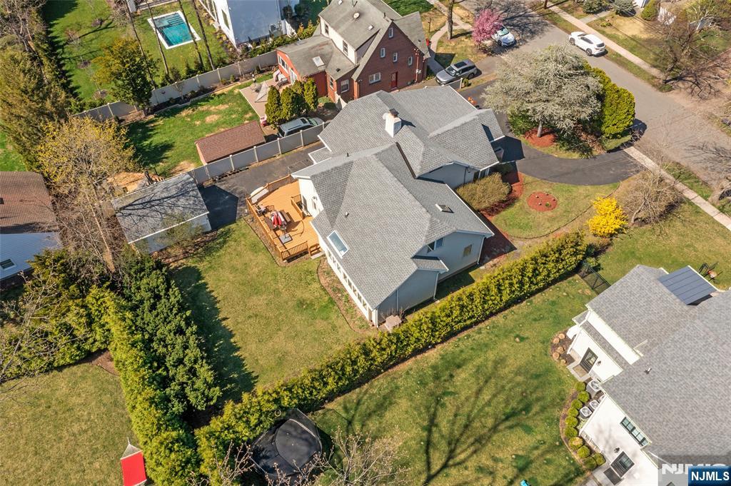 19 Central Avenue Demarest, NJ 07627 - Photo 47 of 49 an aerial view of a house with a garden and swimming pool