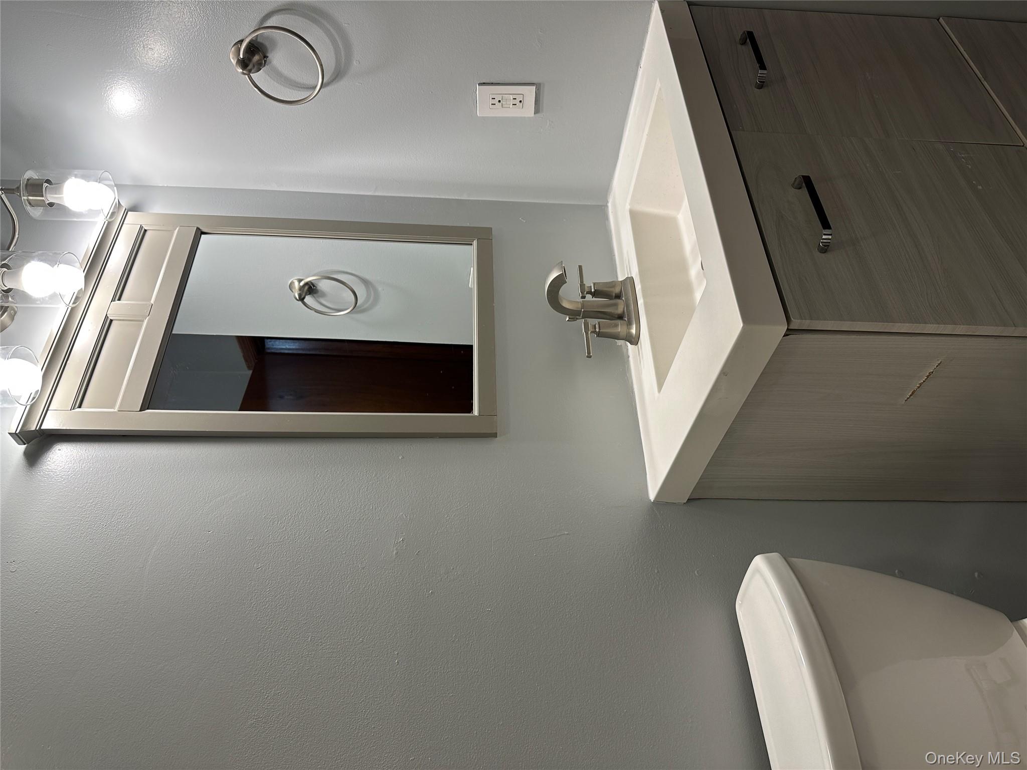 62 New Road Newburgh, NY 12550 - Photo 8 of 14 Bathroom featuring vanity and toilet