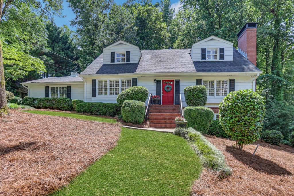 4780 Kings Down Road Dunwoody, GA 30338 - Photo 1 of 1 a front view of a house with garden