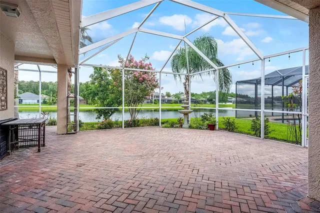 a view of a house with a yard and sitting area