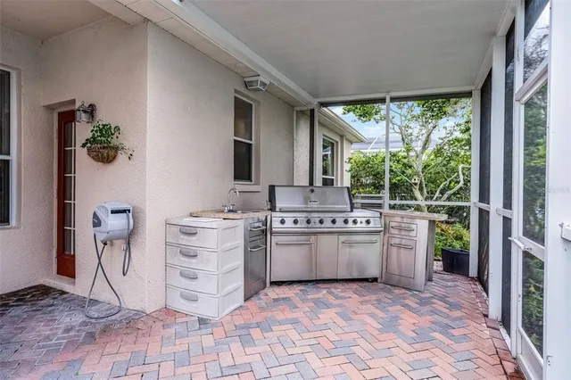 a kitchen with a stove a sink and a refrigerator