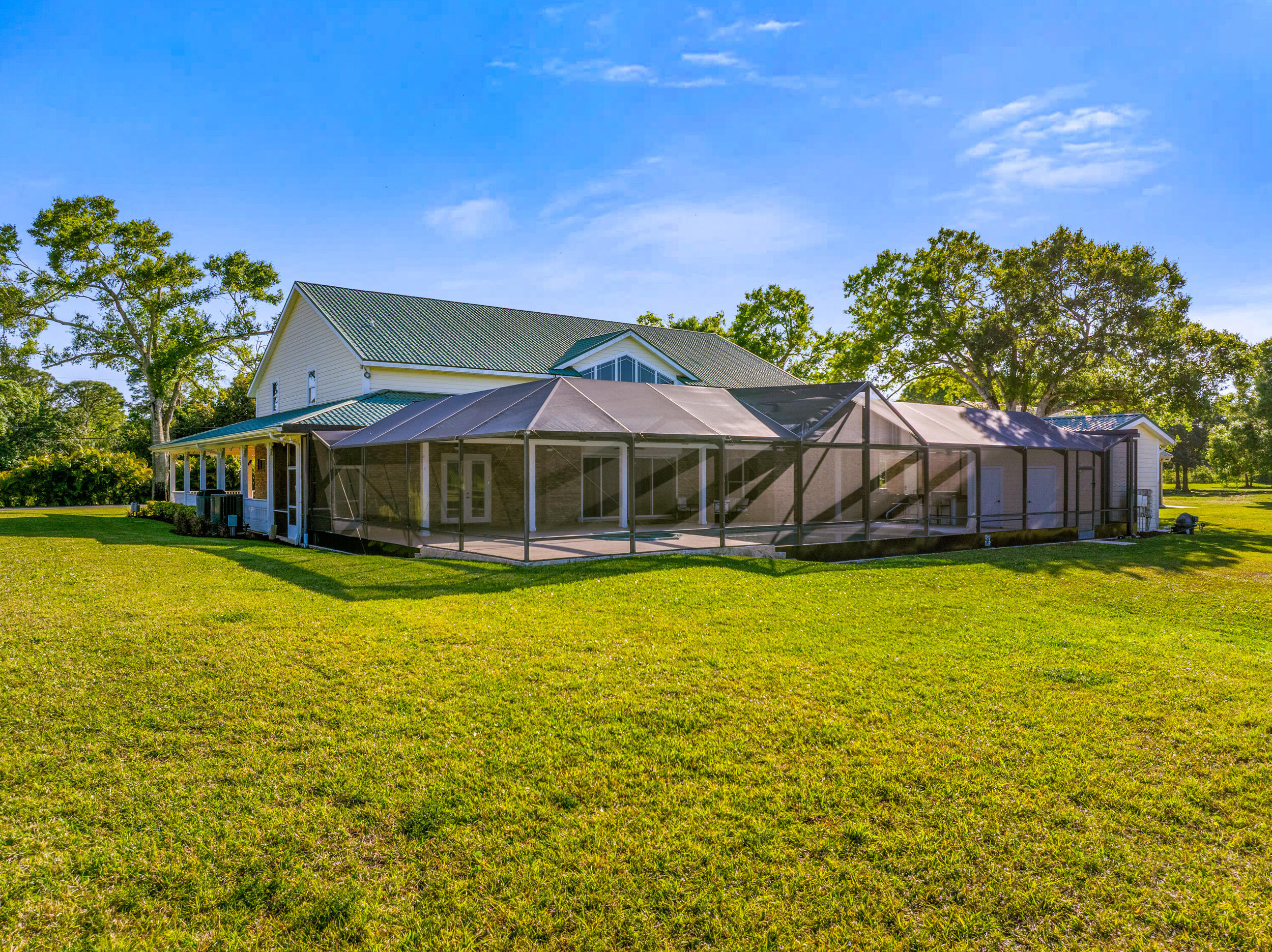 8686 Andrews Avenue Fort Pierce, FL 34945 - Photo 66 of 76 a front view of a house with a garden
