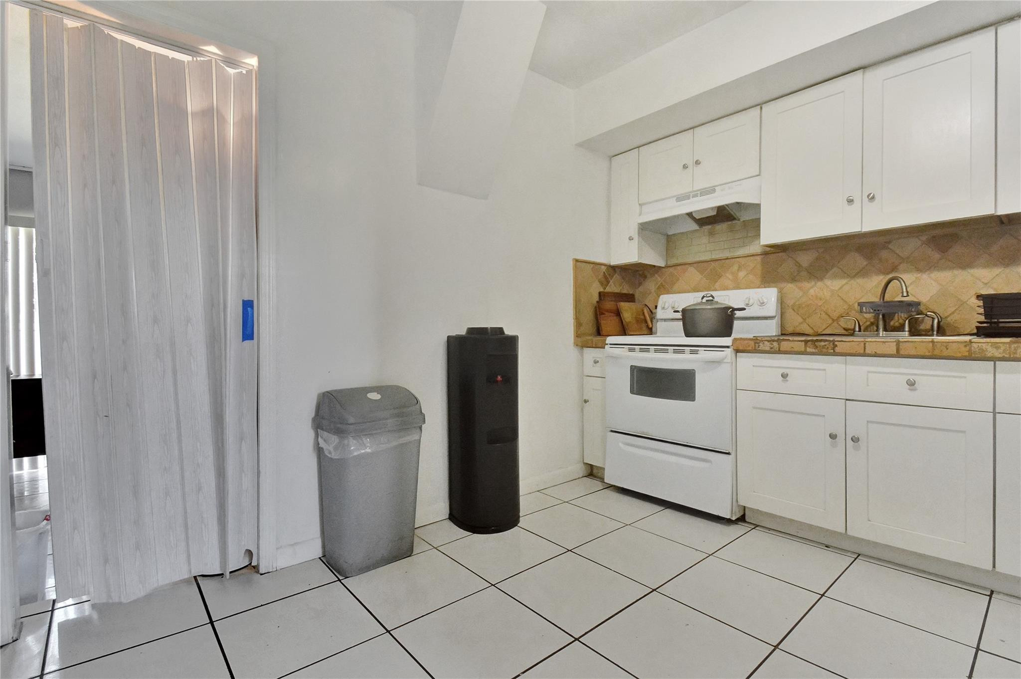 6533 Southwest 22nd Street Miramar, FL 33023 - Photo 7 of 16 Kitchen into Bedroom off Kitchen