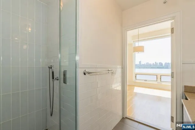 a bathroom with a glass shower door