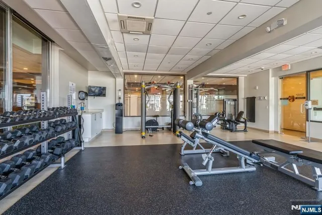 a room with lots of table and chairs