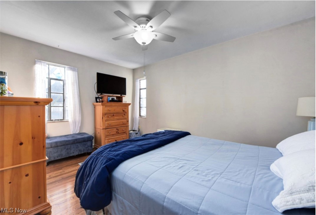 15902 Munn Road Cleveland, OH 44111 - Photo 10 of 27 Bedroom with light hardwood / wood-style flooring and ceiling fan