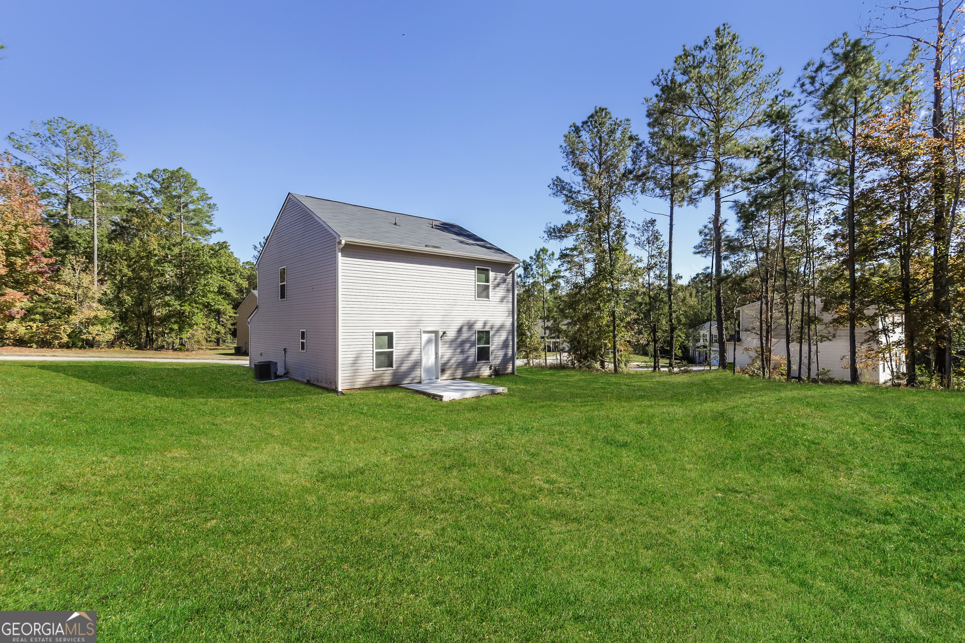20 Sloane Court Covington, GA 30016 - Photo 14 of 16 a backyard of a house with lots of green space