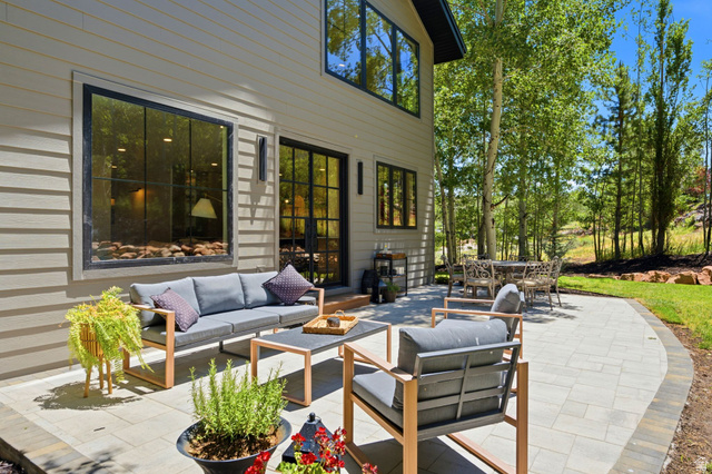 3027 Homestead Road Park City, UT 84098 - Photo 14 of 62 Expansive paver patio with a curved edge, surrounded by mature trees