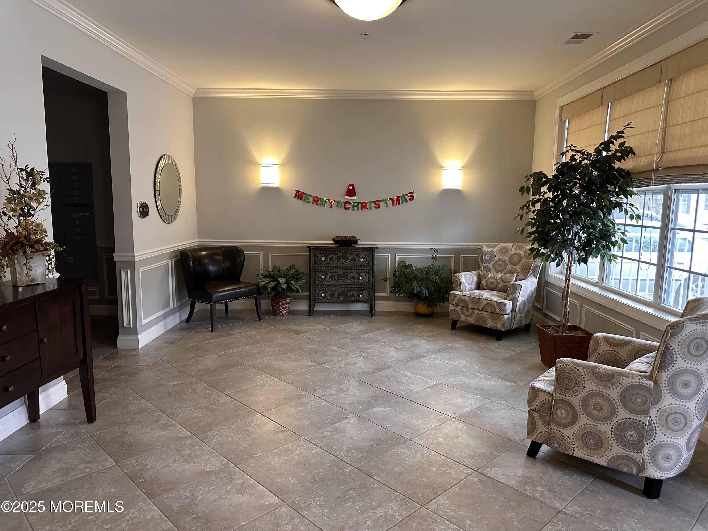 112 Regency Court Morganville, NJ 07751 - Photo 15 of 69 a living room with furniture a window and a potted plant