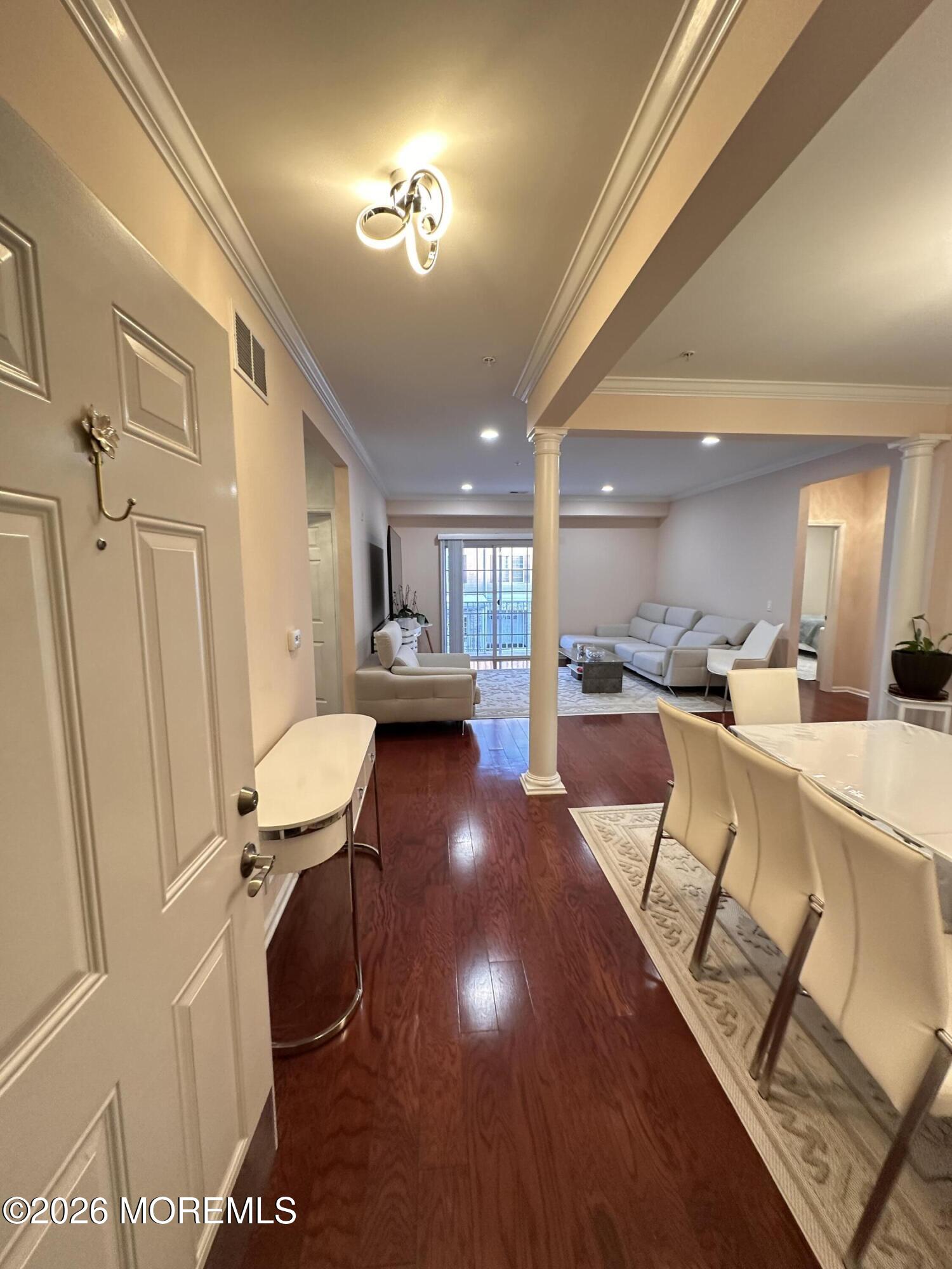 112 Regency Court Morganville, NJ 07751 - Photo 19 of 69 a view of a living room and dining room