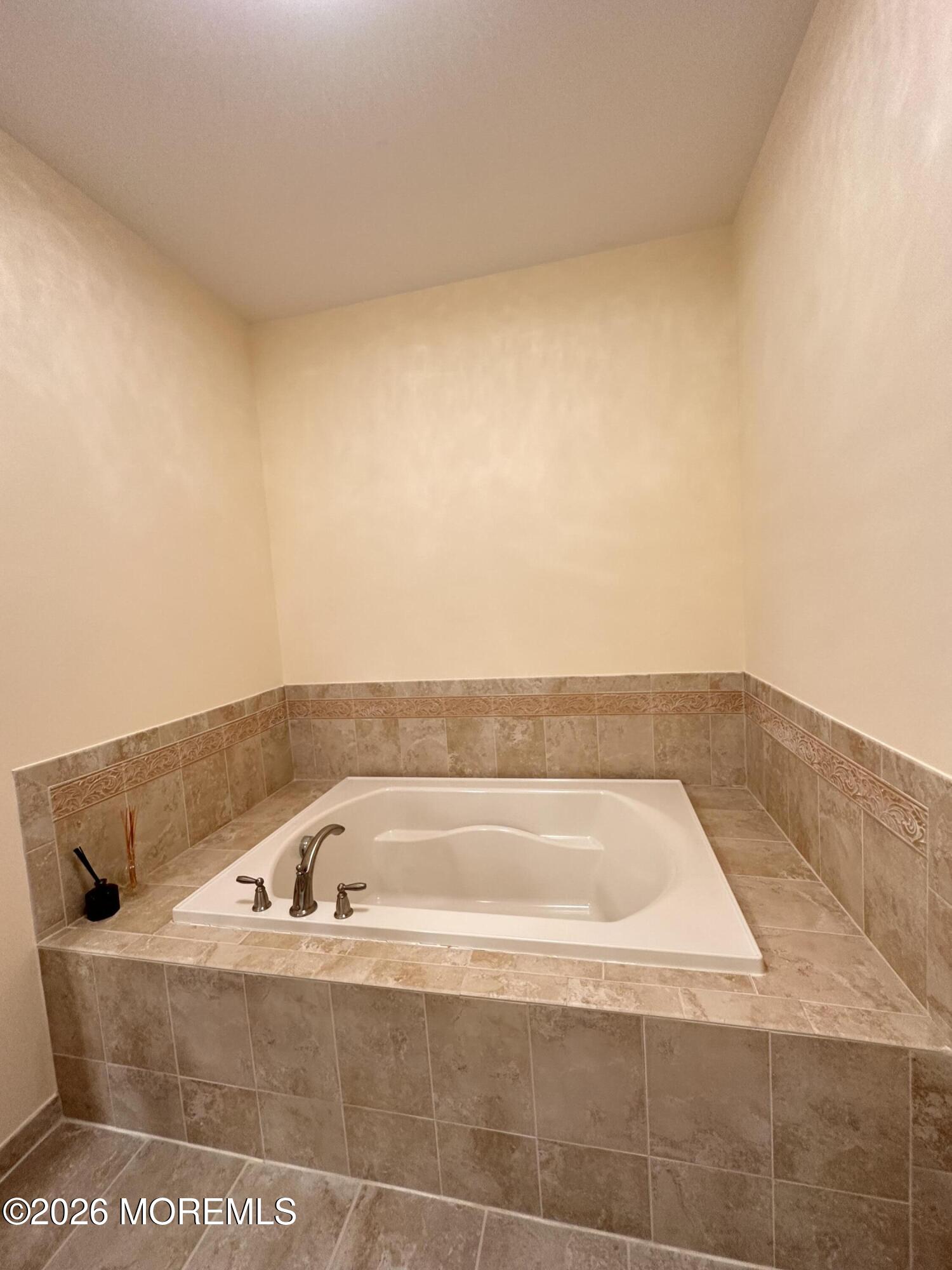 112 Regency Court Morganville, NJ 07751 - Photo 25 of 69 a view of a bathtub in a bathroom