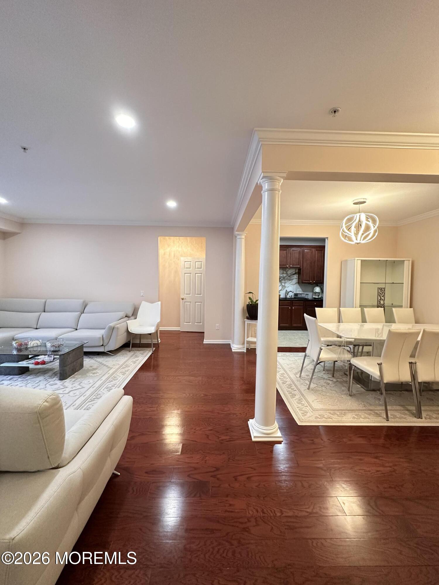 112 Regency Court Morganville, NJ 07751 - Photo 7 of 69 a living room with furniture and a large window