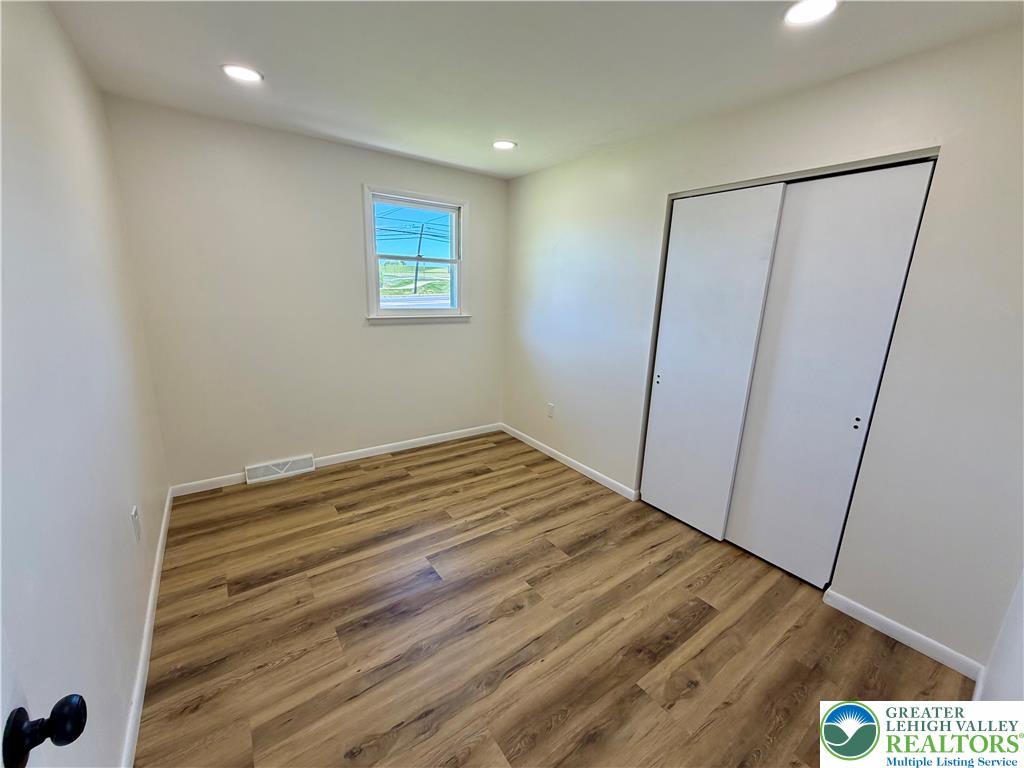 3508 Nazareth Road Easton, PA 18045 - Photo 21 of 25 A well-lit 2nd bedroom features durable laminate flooring and practical closet space.